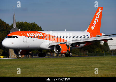 easyJet Airbus A320 jet airliner plane landing at London Southend Airport, Essex, UK using thrust reversing doors to aid braking. Reverse thrust Stock Photo