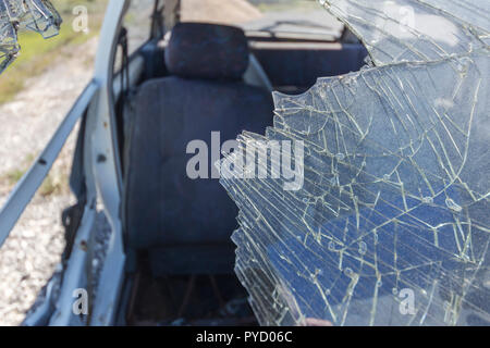 broken windshield on abandoned car Stock Photo
