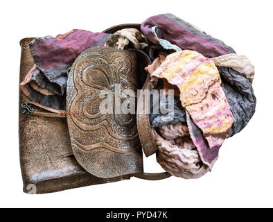 handmade leather handbag with stamped pattern wrapped of the patchwork scarf cut out on white background Stock Photo