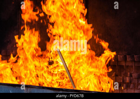 Flames from the burning of candles at the Sanctuary of Our Lady of Fatima, Portugal. Stock Photo
