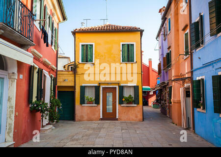 Burano, Italy - October 2018: View of the bright colored houses in Burano