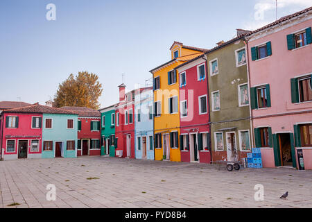 Burano, Italy - October 2018: The colorful fishermen's houses in Burano on a clear day Stock Photo