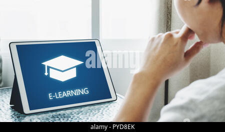 Online education, e-learning and e-book concept. a man using digital tablet for education Stock Photo