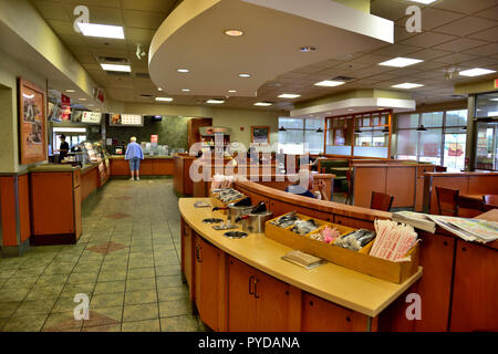 Inside Wendy's Canandaigua, NY, fast-food burger chain serving sides such as chili & baked potatoes with mix of traditional booths and tables with cha Stock Photo
