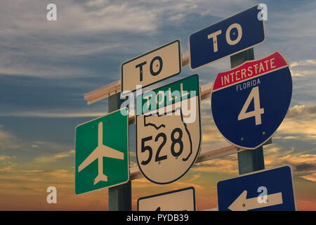 Airport, Interstate 4 sign on sunset sky backround in Destination Parkway, close to International Drive, Orlando, Florida Stock Photo