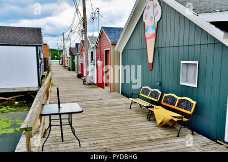 Wooden boat houses (Aquaholicks) along City Pier, Canandaigua Lake, one of the Finger Lakes, NY, USA Stock Photo