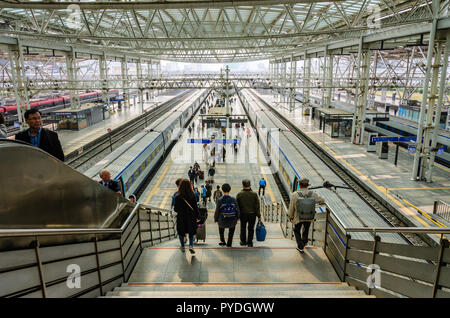 Stairs lead down to trans waiting at platforms at Seoul Railway Station, Seoul. Stock Photo