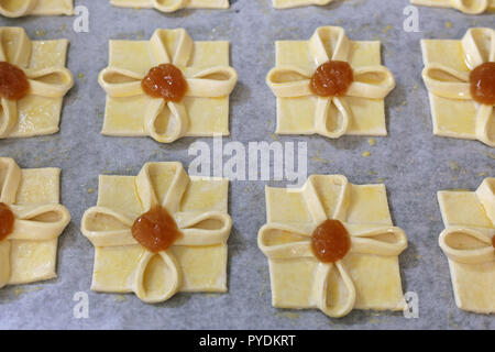 Traditional Finnish sweet Christmas pastries called 'Joulutorttu' in Finnish. These are sweet pastries with some cinnamon apple jam in the middle. Stock Photo