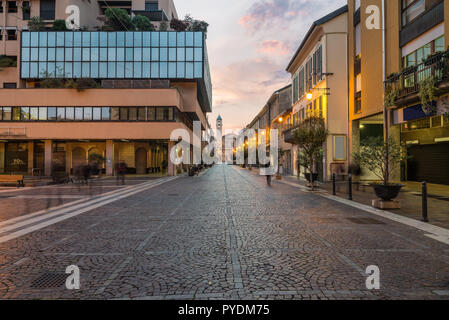 Characteristic street in the historic center of a city in northern Italy. Saronno (corso Italia), province of Varese, Lombardy at sunrise Stock Photo