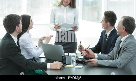 young business woman makes a report on the working meeting Stock Photo