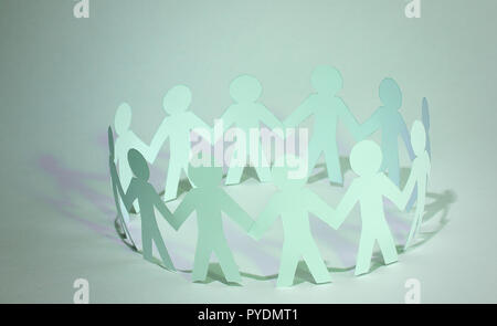 business background.team paper men standing holding hands. Stock Photo