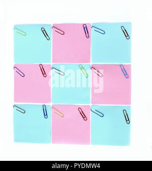 multiple blank sheets for notes with paper clips isolated on whi Stock Photo