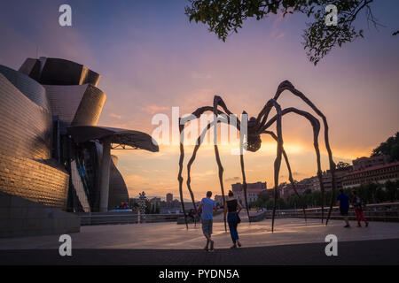 Detail of Guggenheim museum and giant spider sculpture in Bilbao during  the sunset basque Country Spain Stock Photo