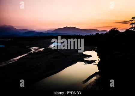 Landscape during the sunset in Villa Tunari, Bolivia. High contrast pic with the river and the mountains in the back Stock Photo