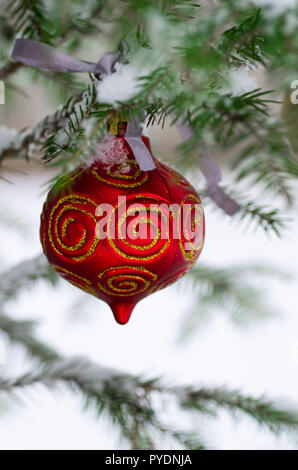 New Year decoration. Christmas background - baubles and branch of spruce tree. Stock Photo