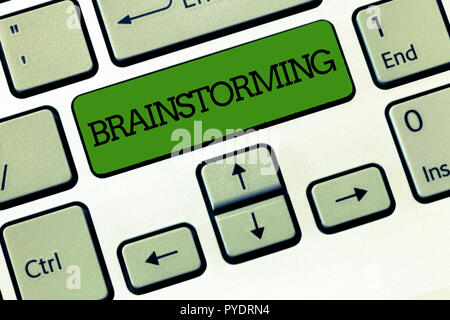 Handwriting text Brainstorming. Concept meaning Hold a group discussion to produce ideas team work Meeting. Stock Photo