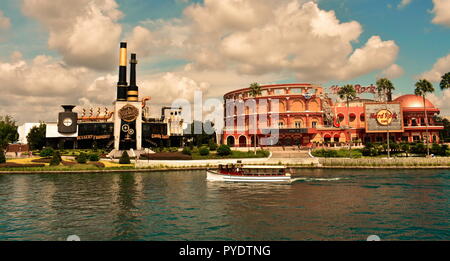 Orlando, Florida. August 11, 2018: Chocolate Emporium and Hard Rock Cafe at Universal Orlando Resort in Florida with the lake on the foreground. Stock Photo