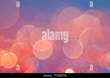 Abstraction orange bokeh on a blue background. Defocused. Free space for text. Stock Photo