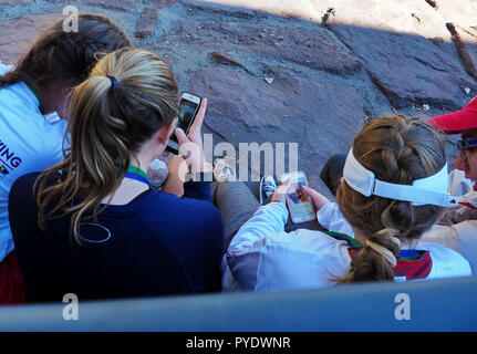 Hartford, CT USA. Oct 2017. Teens staring on smartphones for the good, the bad, and everything else the digital world imposes on all human activity. Stock Photo