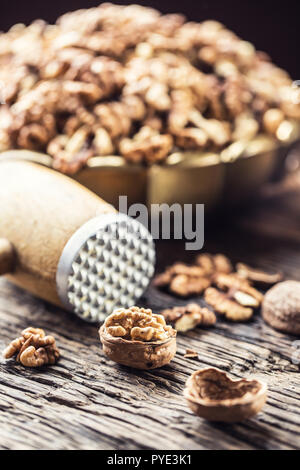 Walnut kernels whole walnuts in burlap sack and vintage bowl. Stock Photo