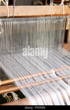 loom with white thread background Stock Photo