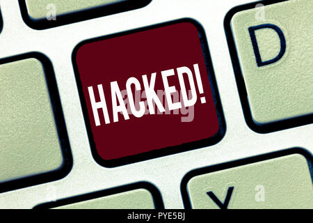Word writing text Hacked. Business concept for Gain unauthorized access to data in system or computer Cyber crime. Stock Photo