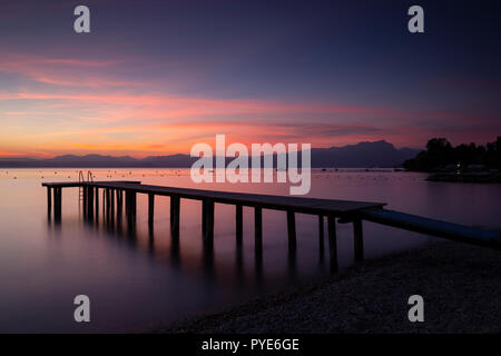 Jetty on Lake Garda at dusk, Italy Stock Photo