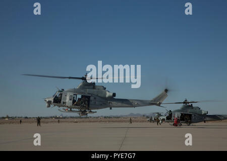 U.S. Marines with Alpha Company, 1st Battalion, 3rd Marine Regiment, prepare to conduct fast-rope training from a UH-1Y Venom helicopter during a simulated raid on an embassy during Talon Exercise (TalonEx) 2018 at Yuma Proving Grounds, Arizona, Sept. 27, 2018. TalonEx is a pre-deployment exercise in conjunction with the Weapons and Tactics Instructors Course that gives Marine ground combat elements the opportunity to work directly with air combat elements in real world scenarios. (U.S. Marine Corps photo by Lance Cpl. Thomas P. Miller) Stock Photo