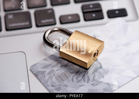 Credit cards on the keyboard with lock close up Stock Photo