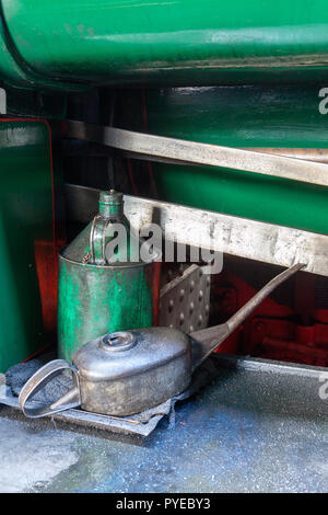 Old oil can in an engineering workshop Stock Photo