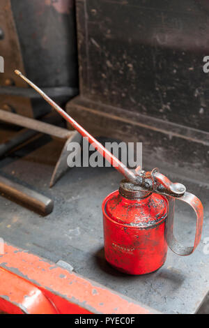 Old oil can in an engineering workshop Stock Photo