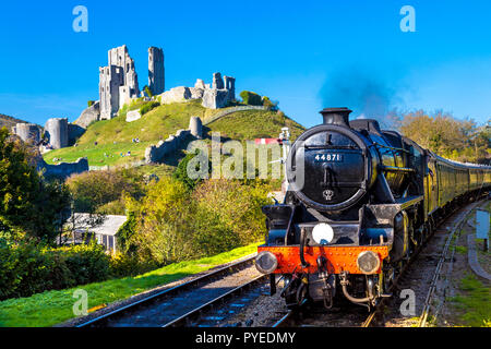 Swanage Railway Steam Train (GWR 0-6-2T 5600 Class) with Corfe Castle in the background, Dorset, UK Stock Photo