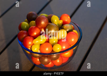 Fresh organic tamatoes on a table Stock Photo