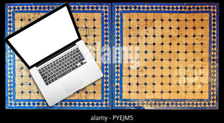 Notebook laptop on Two moroccan mosaic table, view from above Stock Photo