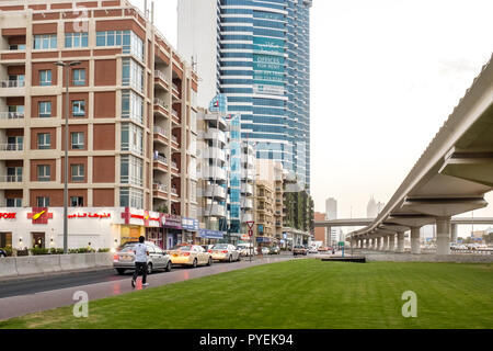 The raised tracks of the Dubai Metro running parallel to the Sheikh Zayed road in the Al Barsha district of Dubai, UAE