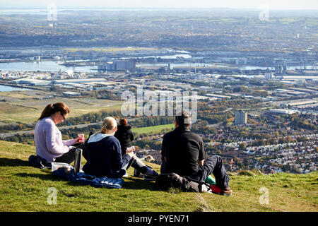 family having picnic on mcarts fort at the top of Cave Hill overlooking belfast on a sunny sunday morning, Belfast, Northern Ireland Stock Photo