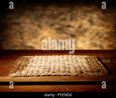 Empty wooden table and defocused brown wall Stock Photo