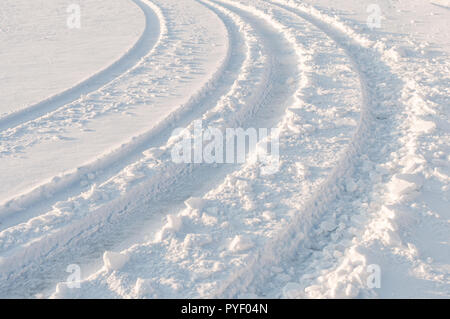 Car Tracks In Fresh White Snow Stock Photo - Alamy