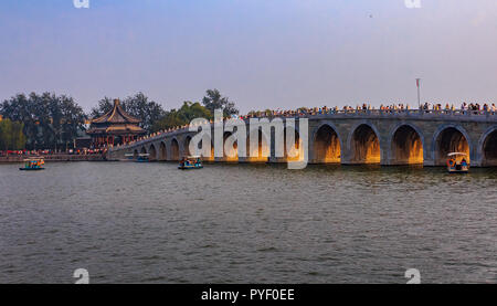 Sunset at the famous 17 arch lion bridge on Kunming Lake outside of Summer Palace in Beijing, China Stock Photo