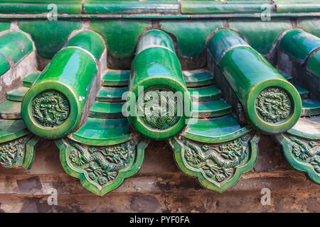 Old ornate roof of Chinese temple with beautiful green glazed tile pattern at the Temple of Heaven in Beijing, China Stock Photo
