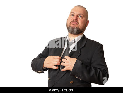 The man of a haughty and proud look in a jacket with a tie and a beard. Stock Photo