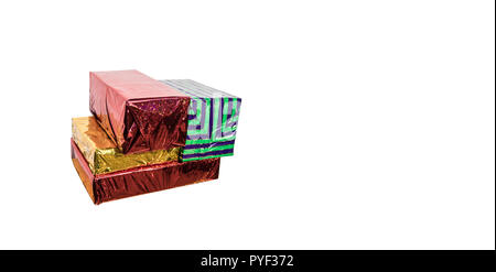Wrapped gift boxes in green, red and gold on a white background 1 Stock Photo