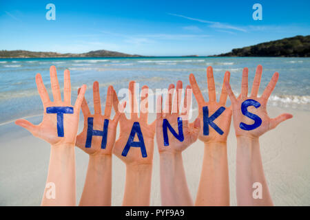 Many Hands Building Word Thanks, Beach And Ocean Stock Photo