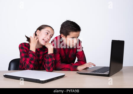 girl and boy using a computer at school Stock Photo