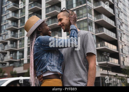 Couple embracing in the city Stock Photo