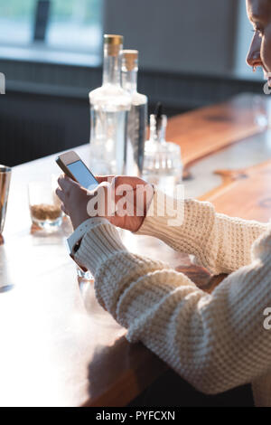 Female worker using mobile phone Stock Photo