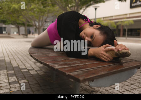 Urban dancer stretching in the city Stock Photo
