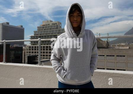Model posing on terrace Stock Photo