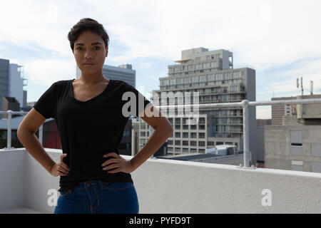 Model posing on terrace Stock Photo
