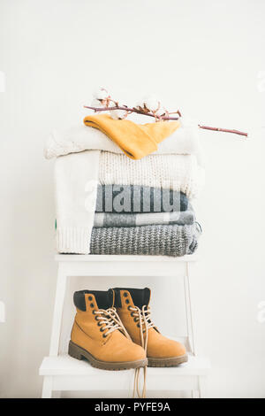 Warm clothing, blankets, boots and cap for winter or fall Stock Photo